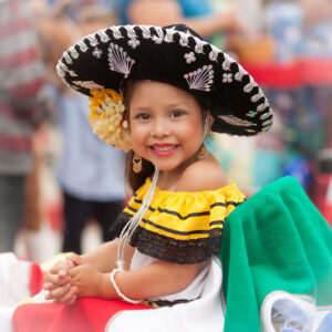 Cute little girl wearing a Mexican sombrero during the Fiesta Childrens' Parade in Santa Barbara