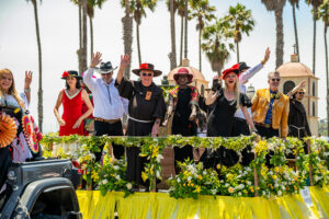 Santa Barbara Fiesta Parade participants on a float near the beach